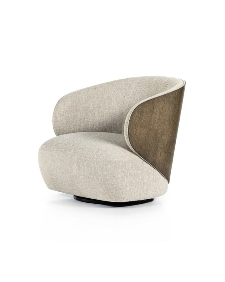 Lorian armchair side view highlighting wooden backrest accent and rounded silhouette by INSIDE HOME.