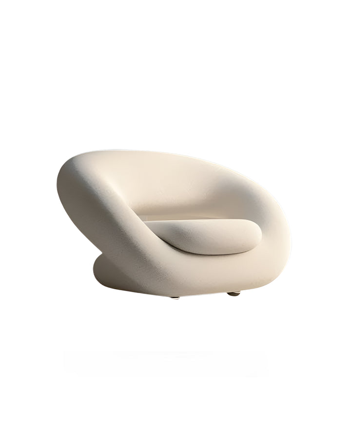 Side angle of Avelis Armchair – contemporary upholstered chair with fluid silhouette