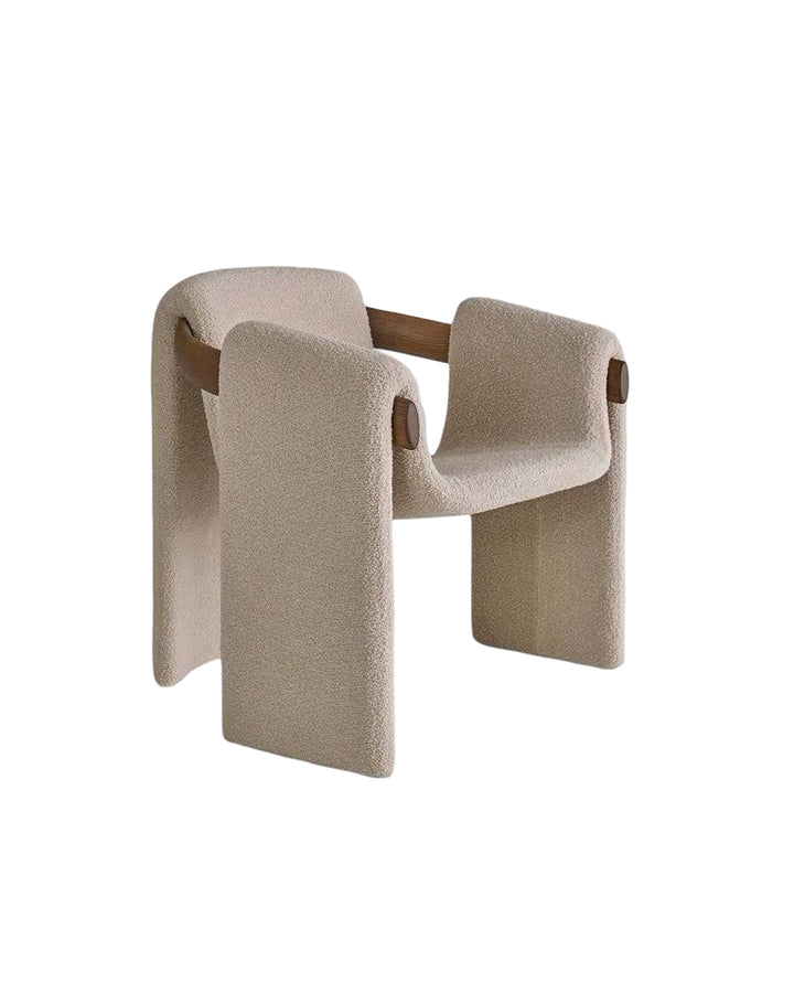 Modern luxury armchair with flowing silhouette and architectural style – side angle.