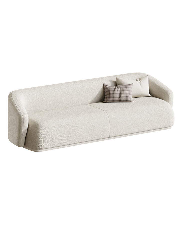 The VIVANTE Sofa embodies modern sophistication with its elongated, minimalist form and soft curved edges. Designed to offer both comfort and refinement, it provides a harmonious blend of elegance and practicality. With its generous seating and smooth lines, the sofa seamlessly adapts to contemporary interiors, adding a touch of vibrancy and timeless charm.
