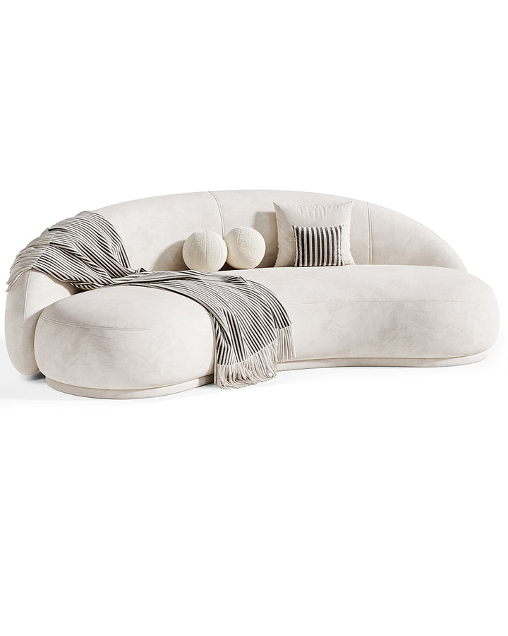 Modern luxury sofa ONIRIA with curved silhouette, upholstered in premium fabric, featuring soft rounded edges and artistic design – INSIDE HOME