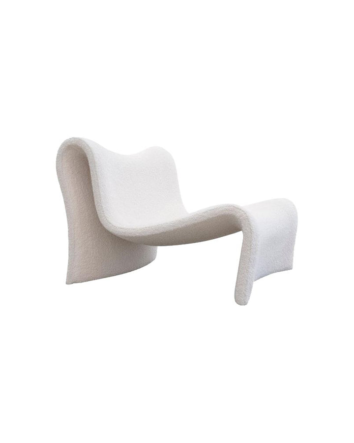 Side view of Seraphis Armchair – modern artistic armchair with flowing wave-like design.