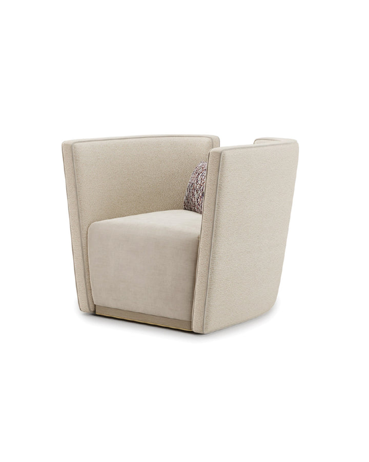 Valerio Armchair side view – modern beige armchair with soft curved design, gold base, and high-end fabric finish.