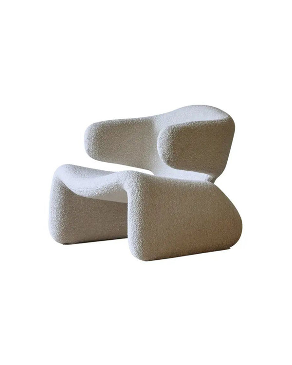 Side angle of Sculptura Armchair showcasing its artistic silhouette