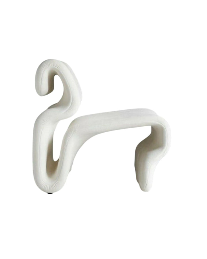 Side view of Aurora Armchair highlighting its fluid and modern design