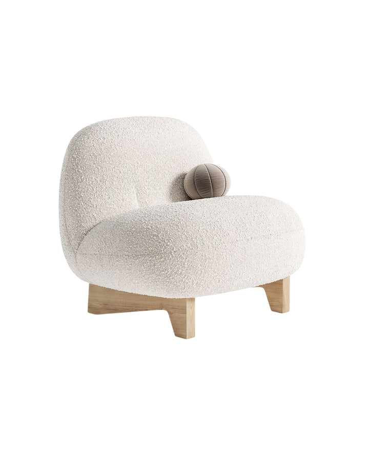 Side view of Vercelli Armchair highlighting sculptural curves and refined structure