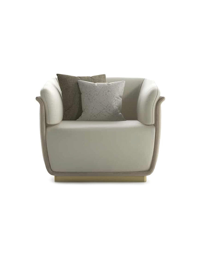 Avorio Armchair front view – luxury modern armchair with vertical detailing and gold base by INSIDE HOME.