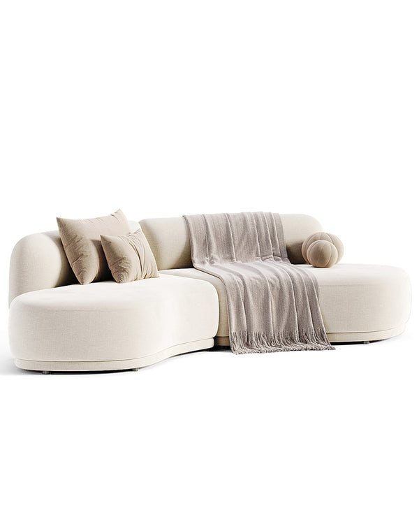 A modern luxury sofa with fluid organic curves and soft rounded edges, upholstered in premium fabric with a sculptural design, ideal for contemporary interiors.