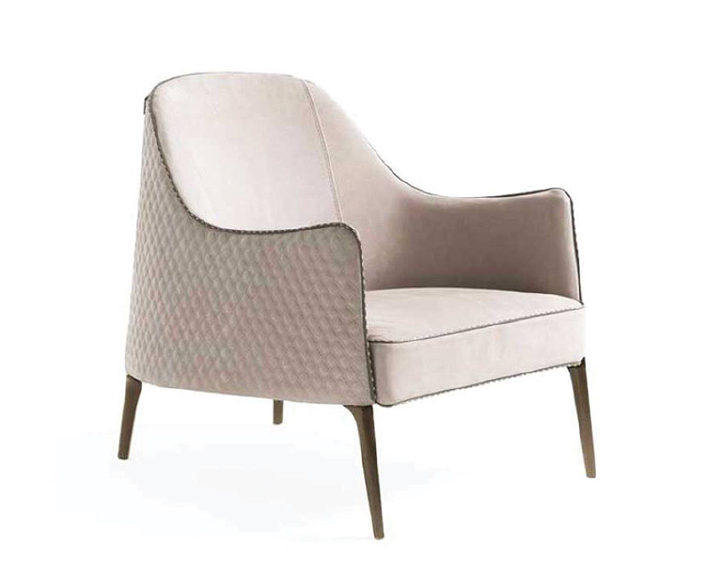 Elvio Armchair side view – minimalist armchair with slim legs and clean contemporary design by INSIDE HOME.
