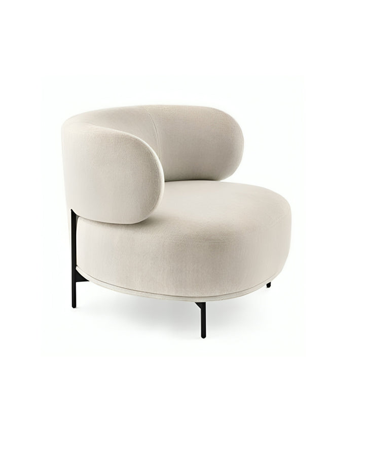Mavell armchair side view highlighting its contemporary curved design and sleek black legs by INSIDE HOME.