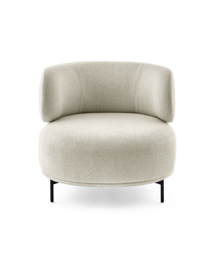 Mavell armchair front view with a modern rounded silhouette and plush cushioning by INSIDE HOME.