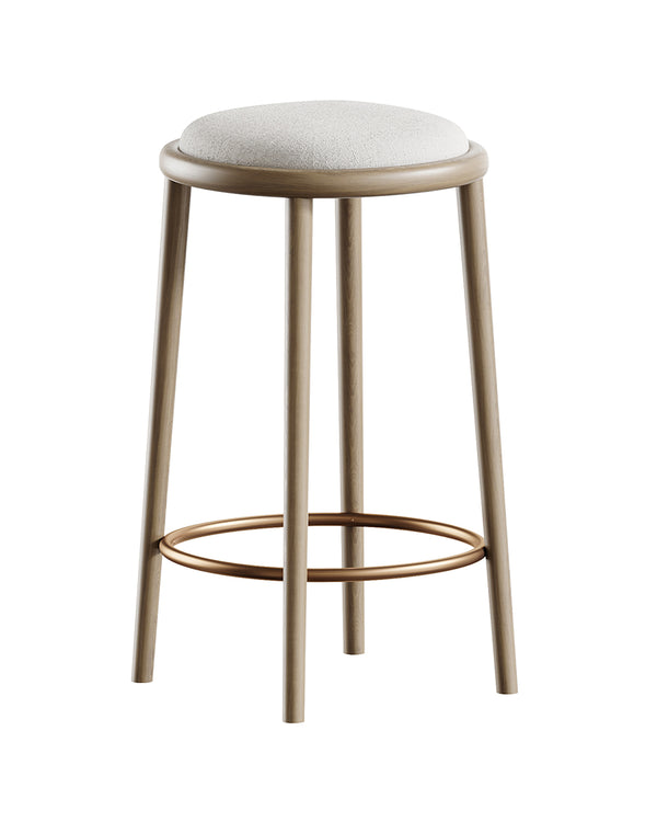 SFERO bar stool with round upholstered seat, cylindrical wooden legs, and golden foot ring by INSIDE HOME.