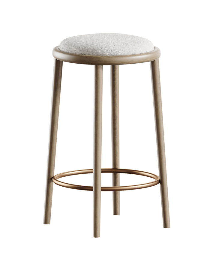 SFERO bar stool with round upholstered seat, cylindrical wooden legs, and golden foot ring by INSIDE HOME.
