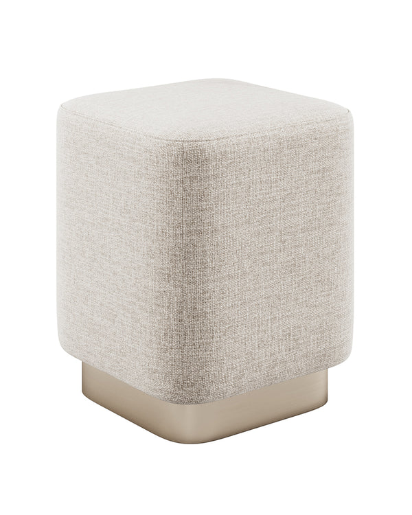 Minimal cubic buff with smooth upholstery and metallic base.