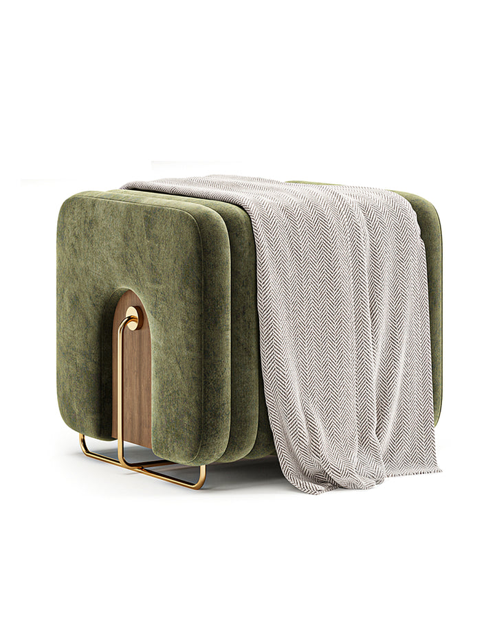 Sculptural buff with golden metal base and wooden inset details.