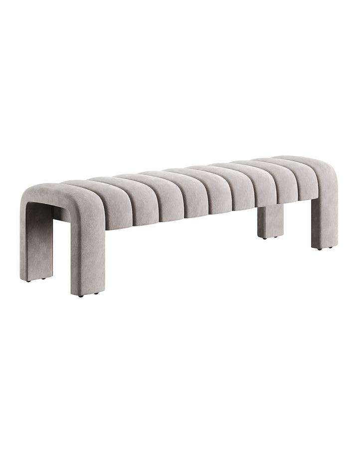 LINEARE Banquette in soft grey velvet with elongated minimalist silhouette designed for modern luxury interiors.