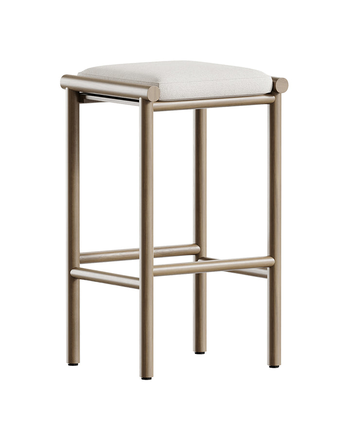 Minimal modern bar stool with metallic frame and soft upholstered seat in beige fabric by INSIDE HOME.